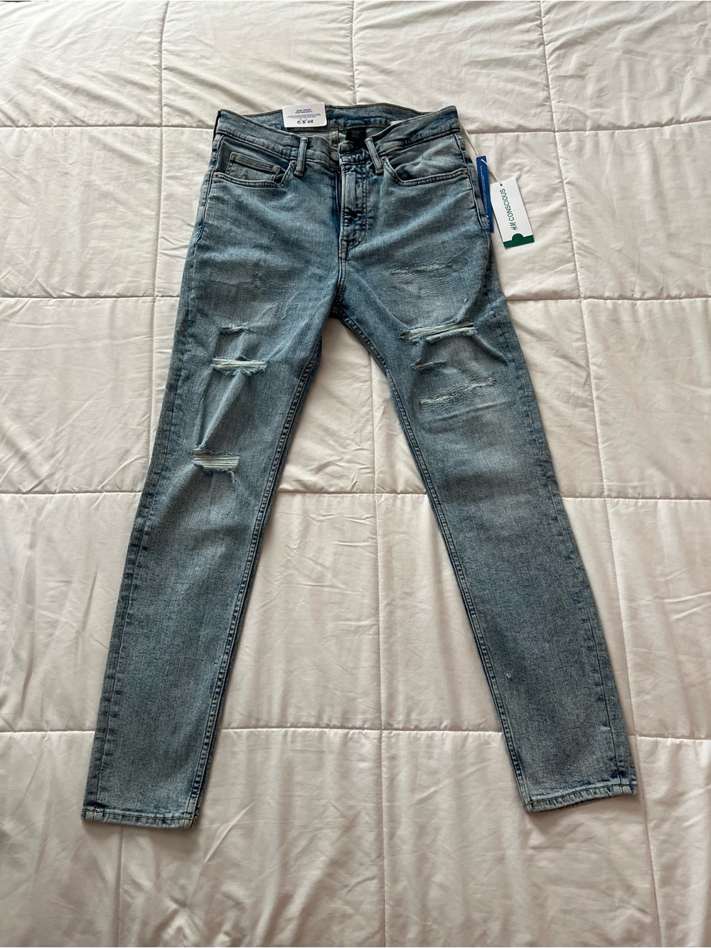 H&M Men's Skinny Jeans in Light Blue with Distressed Knees.